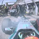Nico Rosberg's brakes smoke as he waits for team mate Lewis Hamilton to leave the Mercedes pit box. © FOWC Ltd