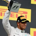 Lewis Hamilton (GBR) Mercedes AMG F1 celebrates on the podium. Formula One World Championship, Rd11, Hungarian Grand Prix, Race Day, Hungaroring, Hungary. Sunday, 27 July 2014