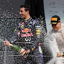 (L to R): Third placed Daniel Ricciardo (AUS) Red Bull Racing and second placed Valtteri Bottas (FIN) Williams Martini Racing spray champagne on the podium. Formula One World Championship, Rd9, British Grand Prix, Race Day, Silverstone, England, Sunday, 6 July 2014
