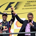 Race winner Daniel Ricciardo (AUS) Red Bull Racing celebrates on the podium WITH Eddie Jordan (IRE) BBC Television Pundit. Formula One World Championship, Rd12, Belgian Grand Prix, Race Day, Spa-Francorchamps, Belgium, Sunday, 24 August 2014. © Sutton Images