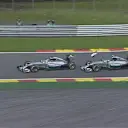 Mercedes' Lewis Hamilton and Nico Rosberg collide at Les Combes while fighting for the lead. Rosberg (right) loses his front wing endplate, while Hamilton suffers a puncture and has to limp back to the pits, dropping to 19th. © FOWC Ltd.