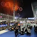 Sebastian Vettel (GER) Red Bull Racing and Lewis Hamilton (GBR) Mercedes AMG F1 W05 in parc ferme. Formula One World Championship, Rd14, Singapore Grand Prix, Marina Bay Street Circuit, Singapore, Race Day, Sunday, 21 September 2014