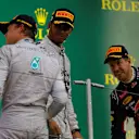 Lewis Hamilton (GBR) Mercedes AMG F1, Nico Rosberg (GER) Mercedes AMG F1 and Sebastian Vettel (GER) Red Bull Racing on the podium with the champagne. Formula One World Championship, Rd15, Japanese Grand Prix, Race, Suzuka, Japan, Sunday, 5 October 2014