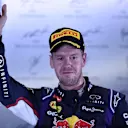 Sebastian Vettel (GER) Red Bull Racing celebrates on the podium. Formula One World Championship, Rd14, Singapore Grand Prix, Marina Bay Street Circuit, Singapore, Race Day, Sunday, 21 September 2014