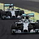 Nico Rosberg (GER) Mercedes AMG F1 W05 leads Lewis Hamilton (GBR) Mercedes AMG F1 W05. Formula One World Championship, Rd18, Brazilian Grand Prix, Race, Sao Paulo, Brazil, Sunday, 9 November 2014