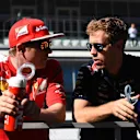 (L to R): Kimi Raikkonen (FIN) Ferrari and Sebastian Vettel (GER) Red Bull Racing on the drivers parade. Formula One World Championship, Rd16, Russian Grand Prix, Race, Sochi Autodrom, Sochi, Krasnodar Krai, Russia, Sunday, 12 October 2014