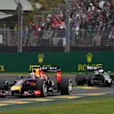 Daniel Ricciardo (AUS) Red Bull Racing RB10 and Kevin Magnussen (DEN) McLaren MP4-29. Formula One World Championship, Rd1, Australian Grand Prix, Race, Albert Park, Melbourne, Australia, Sunday, 16 March 2014
