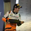 Sergio Perez (MEX) Force India celebrates on the podium. Formula One World Championship, Rd3, Bahrain Grand Prix, Race, Bahrain International Circuit, Sakhir, Bahrain, Sunday, 6 April 2014