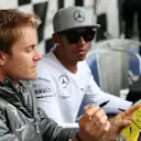 Lewis Hamilton (GBR) Mercedes AMG F1 and Nico Rosberg (GER) Mercedes AMG F1 sign autographs for the fans. Formula One World Championship, Rd7, Canadian Grand Prix, Preparations, Montreal, Canada, Thursday, 5 June 2014