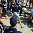 Sebastian Vettel (GER) Red Bull Racing and Daniel Ricciardo (AUS) Red Bull Racing practice their football soccer skills. Formula One World Championship, Rd11, Hungarian Grand Prix, Preparations, Hungaroring, Hungary. Thursday, 24 July 2014