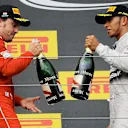 Fernando Alonso (ESP) Ferrari and Lewis Hamilton (GBR) Mercedes AMG F1 celebrate on the podium with the champagne. Formula One World Championship, Rd11, Hungarian Grand Prix, Race Day, Hungaroring, Hungary. Sunday, 27 July 2014