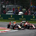 Daniel Ricciardo (AUS) Red Bull Racing RB10 and Kimi Raikkonen (FIN) Ferrari F14 T battle. Formula One World Championship, Rd13, Italian Grand Prix, Monza, Italy, Race Day, Sunday, 7 September 2014