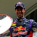 Race winner Daniel Ricciardo (AUS) Red Bull Racing with his trophy and champagne on the podium. Formula One World Championship, Rd12, Belgian Grand Prix, Race Day, Spa-Francorchamps, Belgium, Sunday, 24 August 2014