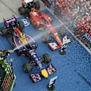 Race winner Daniel Ricciardo (AUS) Red Bull Racing sprays champagne on the podium. Paul Monaghan (GBR) Red Bull Racing Chief Engineer is far left. Formula One World Championship, Rd11, Hungarian Grand Prix, Race Day, Hungaroring, Hungary. Sunday, 27 July 2014