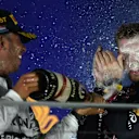 Race winner Lewis Hamilton (GBR) Mercedes AMG F1 celebrates on the podium with Sebastian Vettel (GER) Red Bull Racing and the champagne. Formula One World Championship, Rd14, Singapore Grand Prix, Marina Bay Street Circuit, Singapore, Race Day, Sunday, 21 September 2014