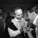 Spa, June 1966: A delighted John Surtees is interviewed following his dominant victory in the Belgian Grand Prix for Ferrari. By the following round he had quit the Italian team and joined Cooper. © Schlegelmilch © No reproduction without permission.