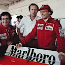 Estoril, October 1984: Niki Lauda pictured with McLaren team mate Alain Prost (left) and team boss Ron Dennis (centre). Lauda would take the world championship by just half a point from Prost. © Schlegelmilch