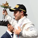 Felipe Massa (BRA) Williams celebrates on the podium with the trophy. Formula One World Championship, Rd18, Brazilian Grand Prix, Race, Sao Paulo, Brazil, Sunday, 9 November 2014