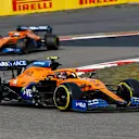 Lando Norris, McLaren MCL35, leads Carlos Sainz, McLaren MCL35