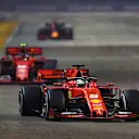 SINGAPORE, SINGAPORE - SEPTEMBER 22: Sebastian Vettel of Germany driving the (5) Scuderia Ferrari SF90 leads Charles Leclerc of Monaco driving the (16) Scuderia Ferrari SF90 on track during the F1 Grand Prix of Singapore at Marina Bay Street Circuit on September 22, 2019 in Singapore. (Photo by Lars Baron/Getty Images)