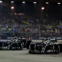 SINGAPORE, SINGAPORE - SEPTEMBER 22: Lewis Hamilton of Great Britain driving the (44) Mercedes AMG Petronas F1 Team Mercedes W10 and Valtteri Bottas driving the (77) Mercedes AMG Petronas F1 Team Mercedes W10 on track during the F1 Grand Prix of Singapore at Marina Bay Street Circuit on September 22, 2019 in Singapore. (Photo by Charles Coates/Getty Images)