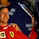 SINGAPORE, SINGAPORE - SEPTEMBER 22: Race winner Sebastian Vettel of Germany and Ferrari celebrates on the podium during the F1 Grand Prix of Singapore at Marina Bay Street Circuit on September 22, 2019 in Singapore. (Photo by Clive Mason/Getty Images)