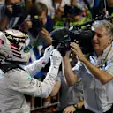 Race winner and 2014 F1 World Champion Lewis Hamilton (GBR) Mercedes AMG F1 signs a camera in parc ferme.
Formula One World Championship, Rd19, Abu Dhabi Grand Prix, Race, Yas Marina Circuit, Abu Dhabi, UAE, Sunday 23 November 2014.
