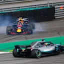 AUTóDROMO JOSé CARLOS PACE, BRAZIL - NOVEMBER 11: Lewis Hamilton, Mercedes AMG F1 W09, passes a spinning Max Verstappen, Red Bull Racing RB14 Tag Heuer, after the latter suffers a collision with Esteban Ocon, Force India VJM11 Mercedes during the Brazilian GP at Autódromo José Carlos Pace on November 11, 2018 in Autódromo José Carlos Pace, Brazil. (Photo by Andy Hone / LAT Images)