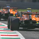 Carlos Sainz, McLaren MCL35, leads Lando Norris, McLaren MCL35