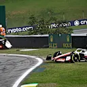 McLaren's Australian driver Daniel Ricciardo (L) and Haas F1 Team's Danish driver Kevin Magnussen go off the track after crashing during the Formula One Brazil Grand Prix at the Autodromo Jose Carlos Pace racetrack, also known as Interlagos, in Sao Paulo, Brazil, on November 13, 2022. (Photo by MAURO PIMENTEL / AFP) (Photo by MAURO PIMENTEL/AFP via Getty Images)