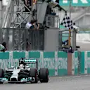 Race winner Lewis Hamilton (GBR) Mercedes AMG F1 W05 takes the chequered flag.
Formula One World Championship, Rd2, Malaysian Grand Prix, Race, Sepang, Malaysia, Sunday 30 March 2014. © Sutton Images