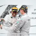 (L to R): race winner Lewis Hamilton (GBR) Mercedes AMG F1 and Nico Rosberg (GER) Mercedes AMG F1 celebrate on the podium with the champagne
Formula One World Championship, Rd2, Malaysian Grand Prix, Race, Sepang, Malaysia, Sunday 30 March 2014. © Sutton Images