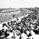 A huge crowd takes in the action. 1950 British Grand Prix
Silverstone, Great Britain. 13th May 1950.
World Copyright: LAT Photographic