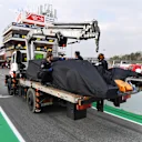 The car of Fernando Alonso (ESP) McLaren MCL33 is recovered to the pits at Formula One Testing, Day One, Barcelona, Spain, 26 February 2018.