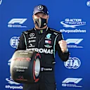 NUERBURG, GERMANY - OCTOBER 10: Pole position qualifier Valtteri Bottas of Finland and Mercedes GP celebrates in parc ferme during qualifying ahead of the F1 Eifel Grand Prix at Nuerburgring on October 10, 2020 in Nuerburg, Germany. (Photo by Wolfgang Rattay - Pool/Getty Images)