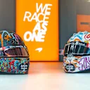 Lando Norris's Mind helmet (L) and Carlos Sainz's Mind helmet (R)