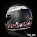 The Ferrari logo is still on the helmet, which fades from white to black