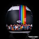 The back of Vettel's helmet shows the glossy rainbow graphic with the crowd of people below