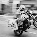 Damon Hill pulls a wheelie for the camera during his motorcycle messenger days
