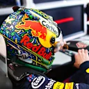 Verstappen gets into his car, sporting the new design, for FP1 in Brazil