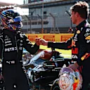 NORTHAMPTON, ENGLAND - JULY 17: Winner Max Verstappen of Netherlands and Red Bull Racing and second placed Lewis Hamilton of Great Britain and Mercedes GP bump fists in parc ferme during the Sprint for the F1 Grand Prix of Great Britain at Silverstone on July 17, 2021 in Northampton, England. (Photo by Mark Thompson/Getty Images)
