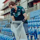 Vettel spent hours after the British Grand Prix on Sunday night picking up litter. Images courtesy of Aston Martin