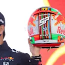 Perez holds up his special Mexico City GP helmet at a pre-race event