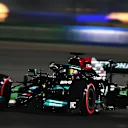 DOHA, QATAR - NOVEMBER 20: Lewis Hamilton of Great Britain driving the (44) Mercedes AMG Petronas F1 Team Mercedes W12 during qualifying ahead of the F1 Grand Prix of Qatar at Losail International Circuit on November 20, 2021 in Doha, Qatar. (Photo by Clive Mason/Getty Images)
