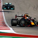 AUSTIN, TEXAS - OCTOBER 24: Max Verstappen of the Netherlands driving the (33) Red Bull Racing RB16B Honda leads Lewis Hamilton of Great Britain driving the (44) Mercedes AMG Petronas F1 Team Mercedes W12 during the F1 Grand Prix of USA at Circuit of The Americas on October 24, 2021 in Austin, Texas. (Photo by Jared C. Tilton/Getty Images)