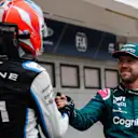 Alpine's French driver Esteban Ocon shakes hands with Aston Martin's German driver Sebastian Vettel after the Formula One Hungarian Grand Prix at the Hungaroring race track in Mogyorod near Budapest on August 1, 2021. (Photo by FLORION GOGA / AFP) (Photo by FLORION GOGA/AFP via Getty Images)