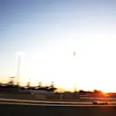 A wide-angled shot of Mazepin driving into the sunset