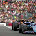 NORTHAMPTON, ENGLAND - JULY 03: Esteban Ocon of France driving the (31) Alpine F1 A522 Renault leads Max Verstappen of the Netherlands driving the (1) Oracle Red Bull Racing RB18 during the F1 Grand Prix of Great Britain at Silverstone on July 03, 2022 in Northampton, England. (Photo by Joe Portlock - Formula 1/Formula 1 via Getty Images)
