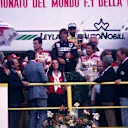 Mario Andretti (far right) is all smiles as he shares the podium with race winner Rene Arnoux and second placed Patrick Tambay. 1982 Italian Grand Prix, Monza. © Sutton Motorsport Images