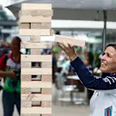 Claire Williams, Deputy Team Principal, Williams Racing, plays a giant Jenga game during the Brazilian GP on November 09, 2018 in Autodromo Jose Carlos Pace, Brazil. (Photo by Glenn Dunbar / LAT Images)